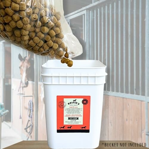 Horse feed being poured into a white bucket in a stable.