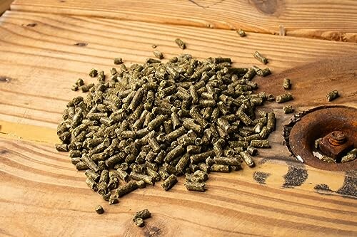 Image of pile of wood pellets on a wooden surface